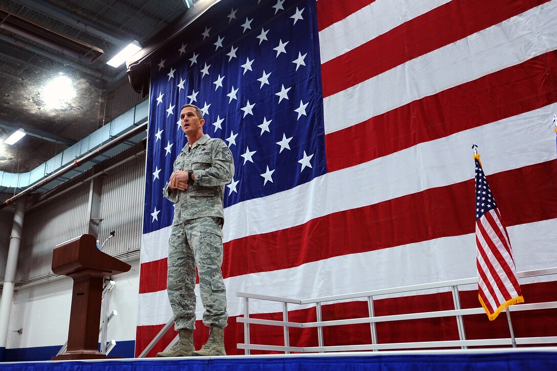 U.S. Air Force Chief Master Sgt. Rick Parsons, command chief of Air Combat Command, speaks at an all call at the Bennie Davis Maintenance Facility Jan. 28, Offutt Air Force Base, Neb.  Hundreds of Airman attended the call to discuss current topics that are reshaping the Air Force.  (U.S. Air Force Photo by Josh Plueger/Released)