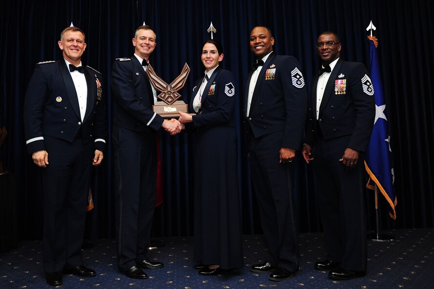 Master Sgt. Ellen Dean, 39th Force Support Squadron, receives the 39th Air Base Wing Senior Noncommissioned Officer of the Year award from Col. Craig Wills, 39th Air Base Wing commander, during the 2013 Annual Awards Banquet Feb. 4, 2014, at Incirlik Air Base, Turkey. Also there for the award presentations were Gen. Frank Gorenc (left), U.S. Air Forces in Europe and U.S. Air Forces Africa commander, Chief Master Sgt. Anthony Johnson, 39th ABW command chief, and Chief Master Sgt. James Davis (right), USAFE-AFAFRICA command chief. (U.S. Air Force photo by Airman 1st Class Nicole Sikorski/Released)