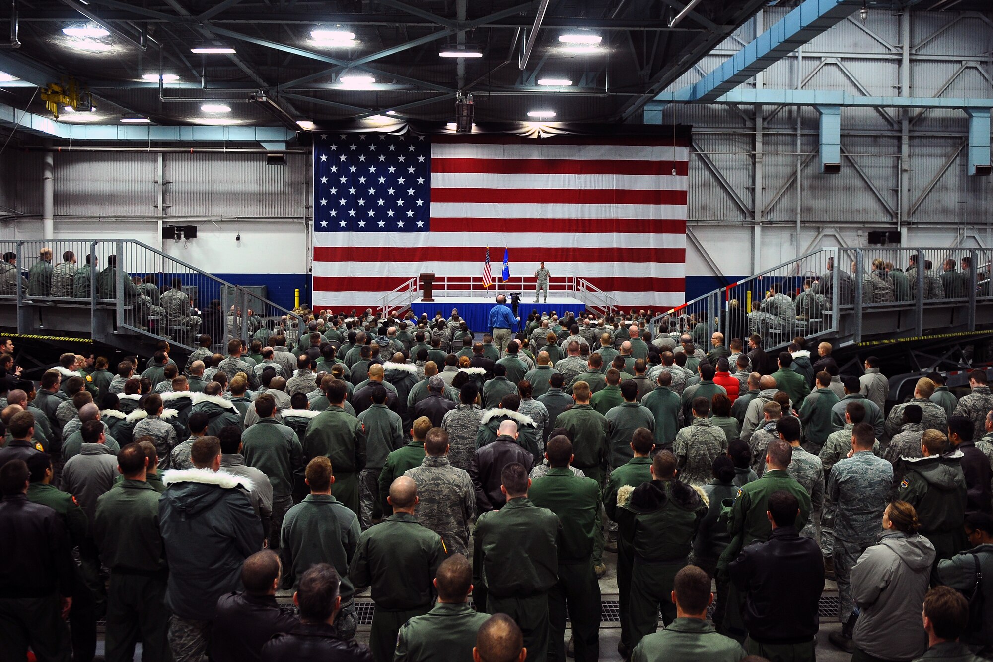 U.S. Air Force Chief Master Sgt. Rick Parsons, command chief of Air Combat Command, speaks at an all call at the Bennie Davis Maintenance Facility Jan. 28, Offutt Air Force Base, Neb.  Hundreds of Airman attended the call to discuss current topics that are reshaping the Air Force.  (U.S. Air Force Photo by Josh Plueger/Released)