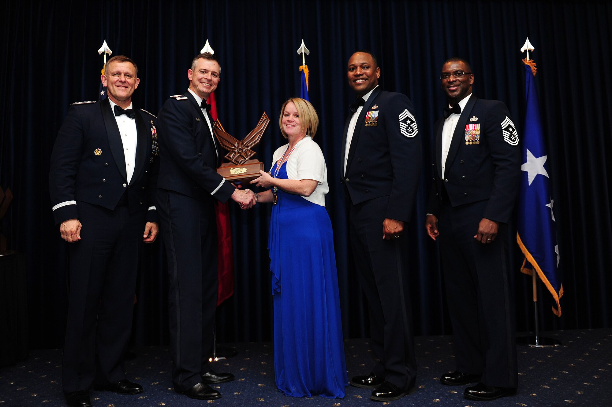 Victoria Jones, 39th Medical Group, receives the 39th Air Base Wing Civilian of the Year Category I award from Col. Craig Wills, 39th Air Base Wing commander, during the 2013 Annual Awards Banquet Feb. 4, 2014, at Incirlik Air Base, Turkey. Also there for the award presentations were Gen. Frank Gorenc (left), U.S. Air Forces in Europe and U.S. Air Forces Africa commander, Chief Master Sgt. Anthony Johnson, 39th ABW command chief, and Chief Master Sgt. James Davis (right), USAFE-AFAFRICA command chief. (U.S. Air Force photo by Airman 1st Class Nicole Sikorski/Released)
