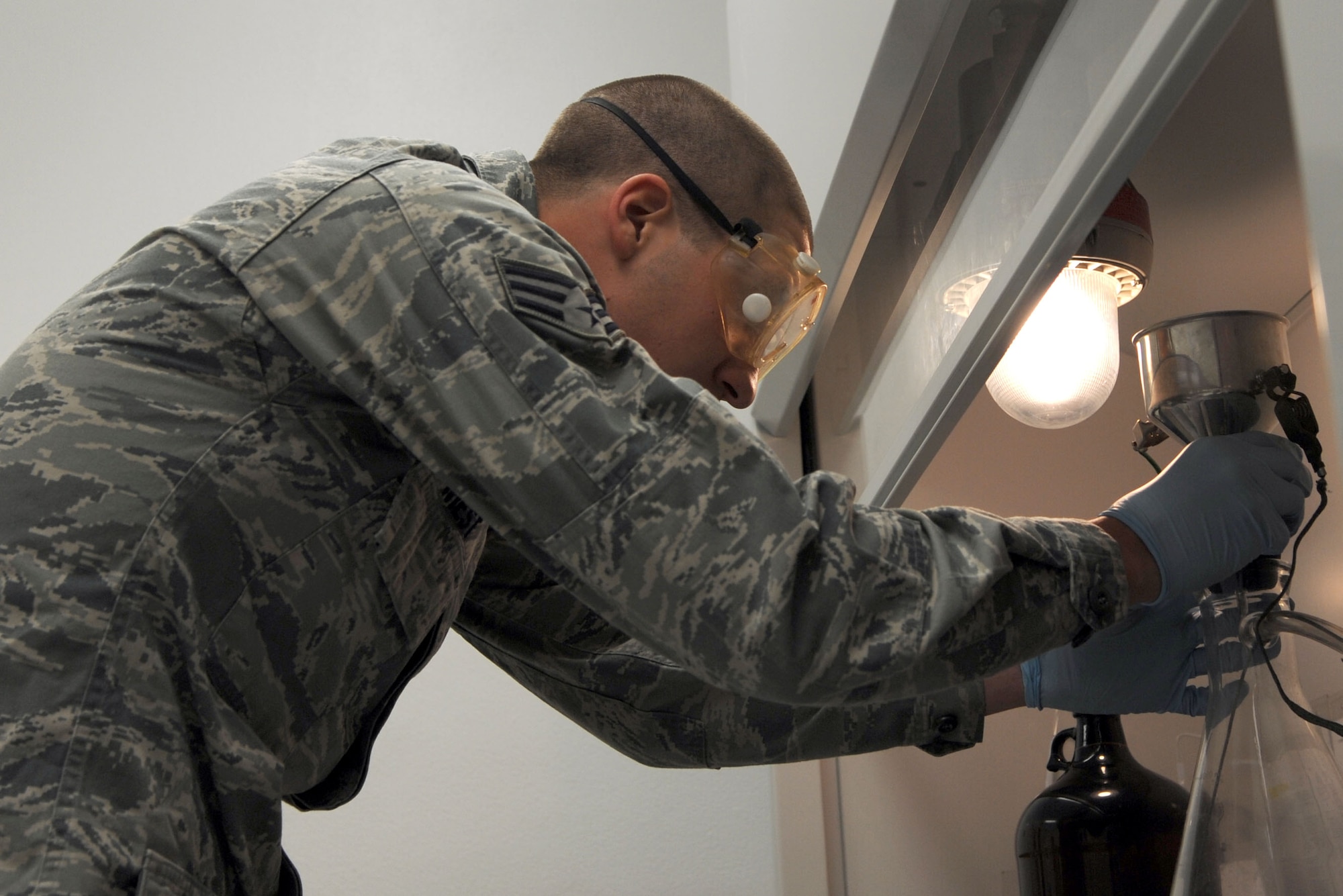 ALTUS AIR FORCE BASE, Okla. – U.S. Air Force Senior Airman Zakkary Wiest, 97th Logistics Readiness Squadron fuels apprentice, prepares a fuel sample test Jan. 31, 2014. Airmen who work in the fuels lab test fuel samples to ensure standards set by Air Force regulations are met. (U.S. Air Force photo by Airman 1st Class J. Zuriel Lee/Released)