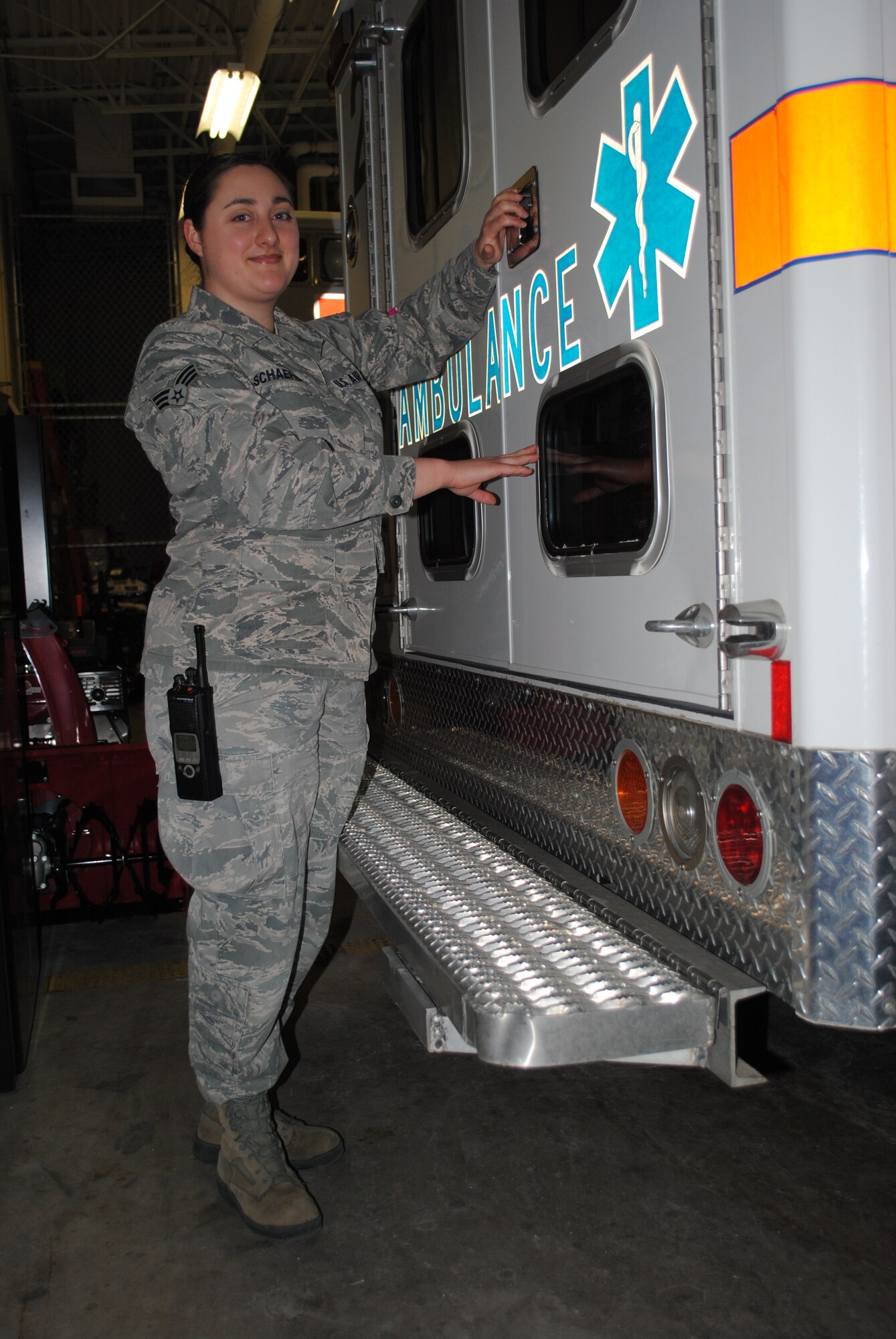 Senior Airman Amanda Schaefer, 319th Medical Operations Squadron aerospace medical technician, secures the rear doors to an ambulance Jan. 29, 2014, at the ambulance bay on Grand Forks Air Force Base, N.D.  Aerospace medical technician sometimes perform duties similar to Emergency Medical Technicians or paramedics. (U.S. Air Force photo/Staff Sgt. Luis Loza Gutierrez) 
