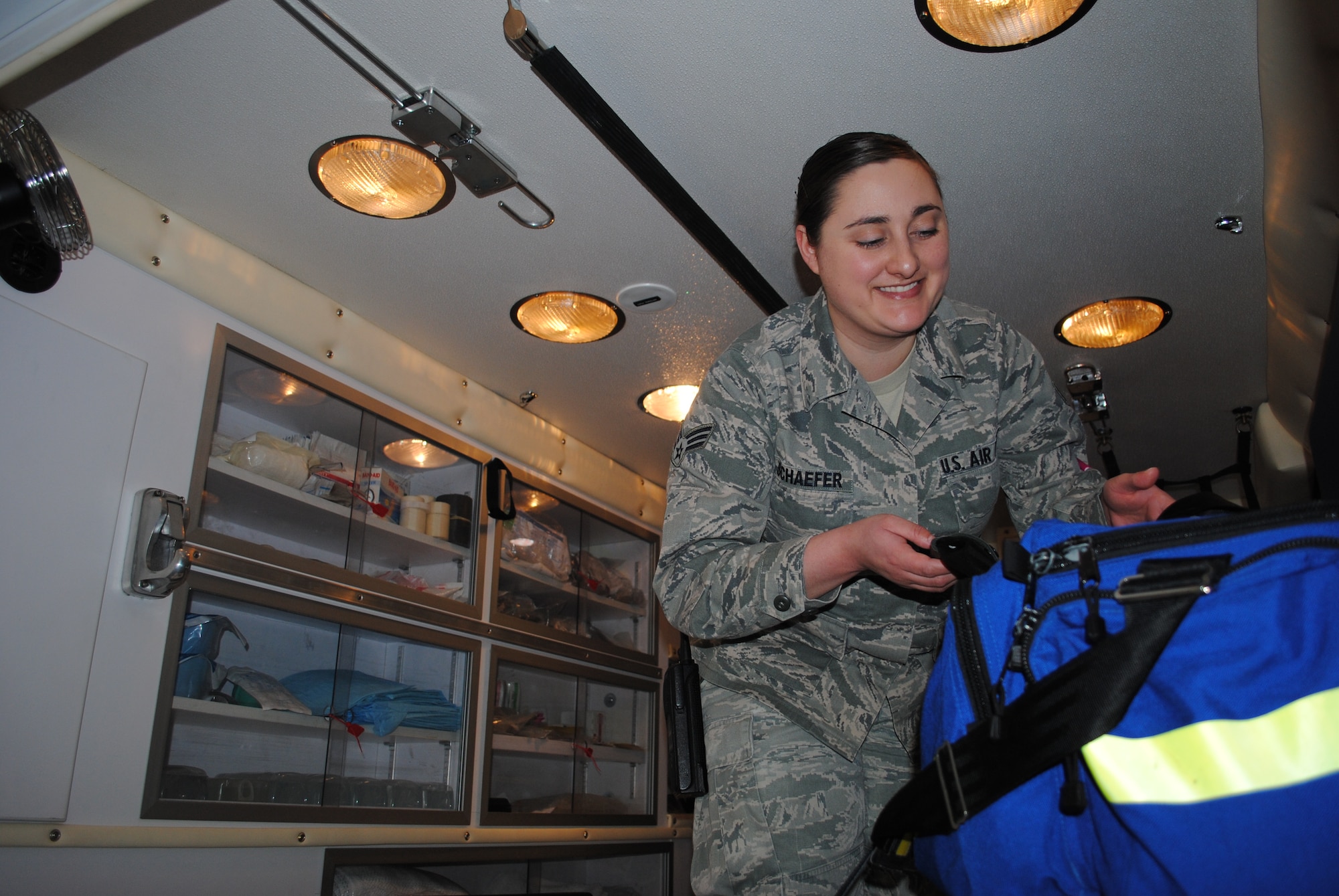 Senior Airman Amanda Schaefer, 319th Medical Operations Squadron aerospace medical technician, secures a medical equipment bag inside an ambulance Jan. 29, 2014, at the ambulance bay on Grand Forks Air Force Base, N.D.  The 26-year-old from Asheville, N.C., was named the base’s Warrior of the Week for the first week of February 2014. (U.S. Air Force photo/Staff Sgt. Luis Loza Gutierrez) 