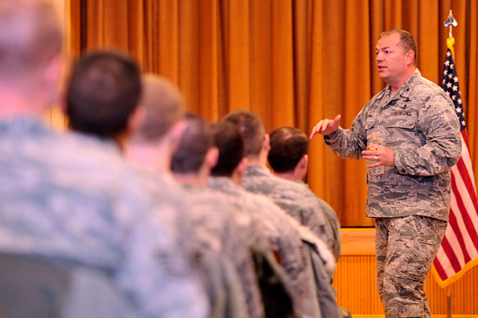 Colonel Michael Finn II, Pacific Air Forces director of communications and chief information officer, speaks to Airmen of the 35th Communication Squadron at Misawa Air Base, Japan, Feb. 4, 2014. Finn leads a Warfighting HQ staff providing cyberspace operations and combat communications reachback support to the PACAF commander, combatant commanders, and PACAF assigned forces. (U.S. Air Force photo by Staff Sgt. Tong Duong)