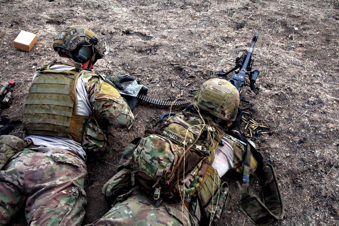 Army Rangers fire an M249B automatic weapon during live-fire training on Camp Roberts, Calif., Jan. 30, 2014. The Rangers are assigned to Company B, 2nd Battalion, 75th Ranger Regiment.