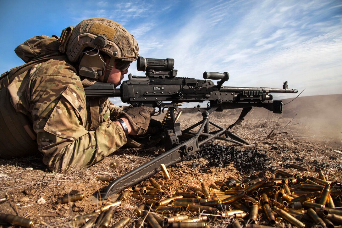 An Army Ranger provides suppressive fire with an M249B automatic weapon during ive-fire training on Camp Roberts, Calif., Jan. 31, 2014.