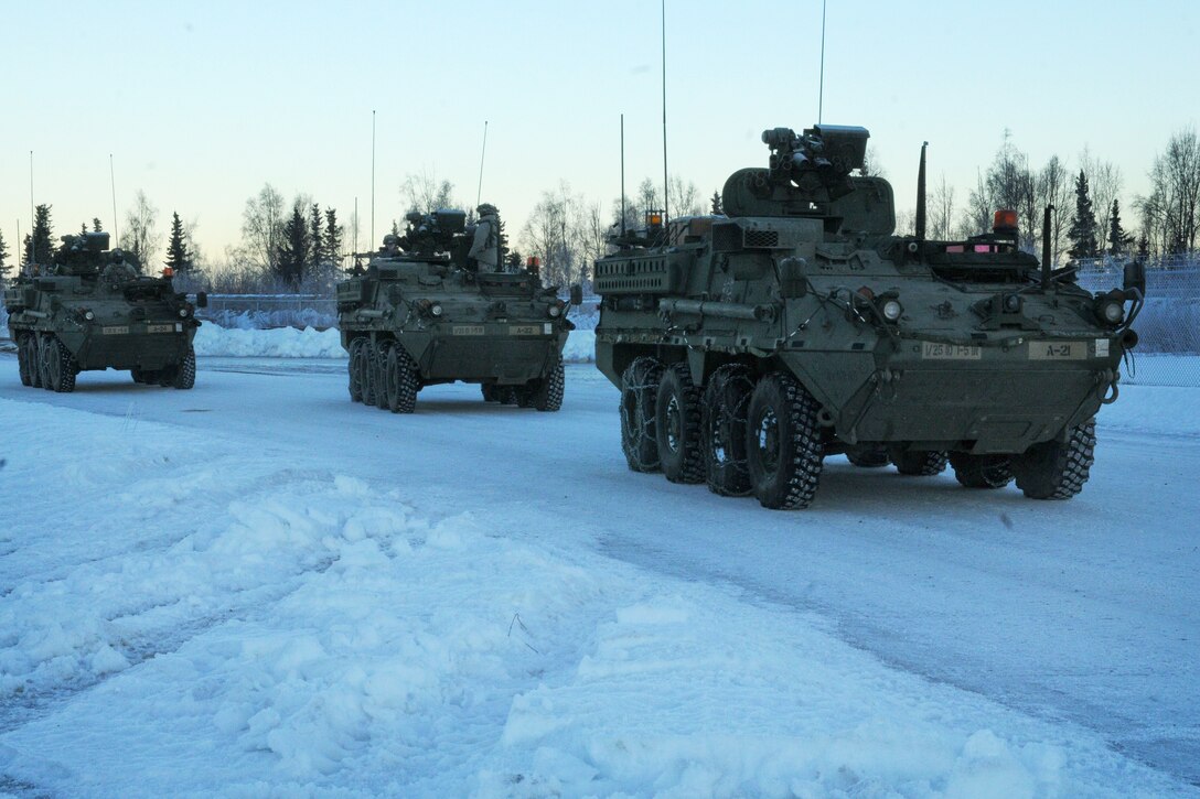 A convoy of Stryker vehicles get ready for a mission after refueling on Forward Operating Base Sparta on Joint Base Elmendorf-Richardson, Alaska, Jan. 30, 2014. The soldiers are assigned to the 25th Infantry Division's 1st Battalion, 5th Infantry Regiment, 1st Stryker Brigade Combat Team. The Stryker unit made the nearly 400-mile trip from Fort Wainwright near Fairbanks, Alaska, to support a nine-day field training exercise for their sister brigade, the 4th Infantry Brigade Combat Team.