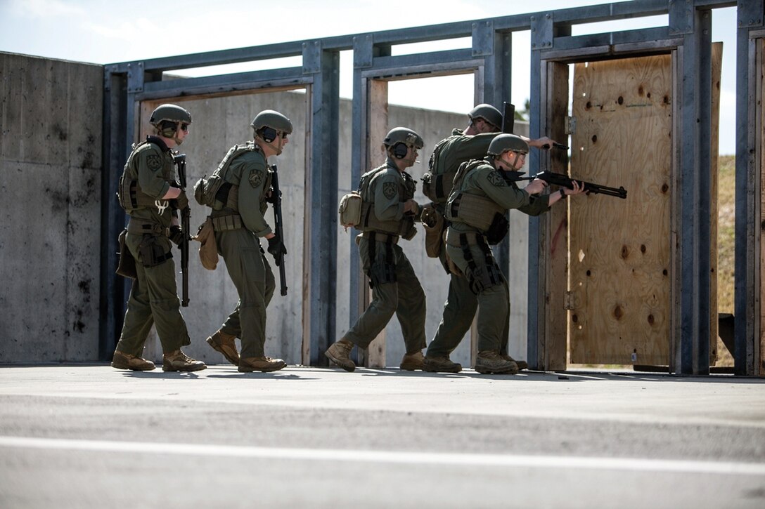 Marines with the Special Reaction Team breach an entryway using the M1014 joint service combat shotgun Jan. 28 at Camp Hansen. The team’s continuous training allows it to maintain the readiness required to respond to a wide range of emergencies with speed, proficiency and effectiveness when the call is made. The team is with the Provost Marshal’s Office, Headquarters and Service Battalion, Marine Corps Base Camp Smedley D. Butler, Marine Corps Installations Pacific. Photo by Cpl. Jose D. Lujano
