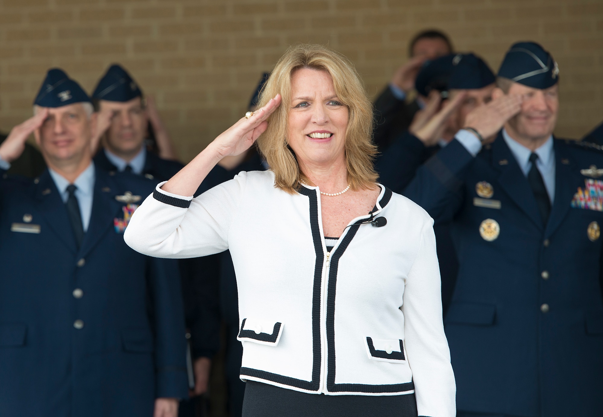 The Honorable Deborah L. James, Secretary of the Air Force, renders a salute during pass and review at the basic military training graduation January 31, 2014, at Joint Base San Antonio-Lackland. During her visit, James toured dormitory facilities and visited with officials at the 24th Air Force Headquarters before concluding her one-day visit with an Air Education and Training Command all call. (U.S. Air Force photo/Benjamin Faske)