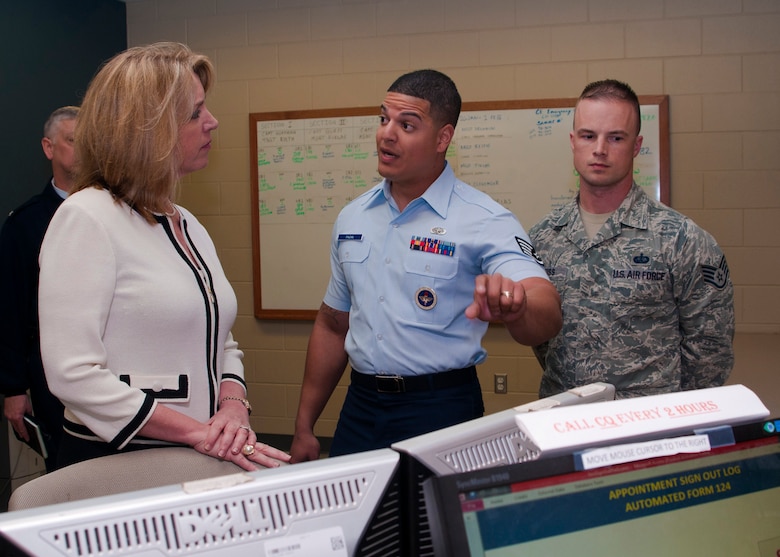 Secretary of the Air Force Deborah Lee James is briefed on the command of quarters procedures by Tech. Sgt. Christian Pagan-Guzman and Staff Sgt. Dennis Weiss during a tour of the 323rd Training Squadron facilities Jan. 31 at Joint Base San Antonio-Lackland, Texas. During her visit, the SecAF received a mission brief of the 37th Training Wing, discussed the way ahead with installation leadership and held an all call with Air Education and Training personnel. Pagan-Guzman and Weiss at both military training instructors with the 323rd Training Squadron. (U.S. Air Force photo/Staff Sgt. Marissa Tucker) 