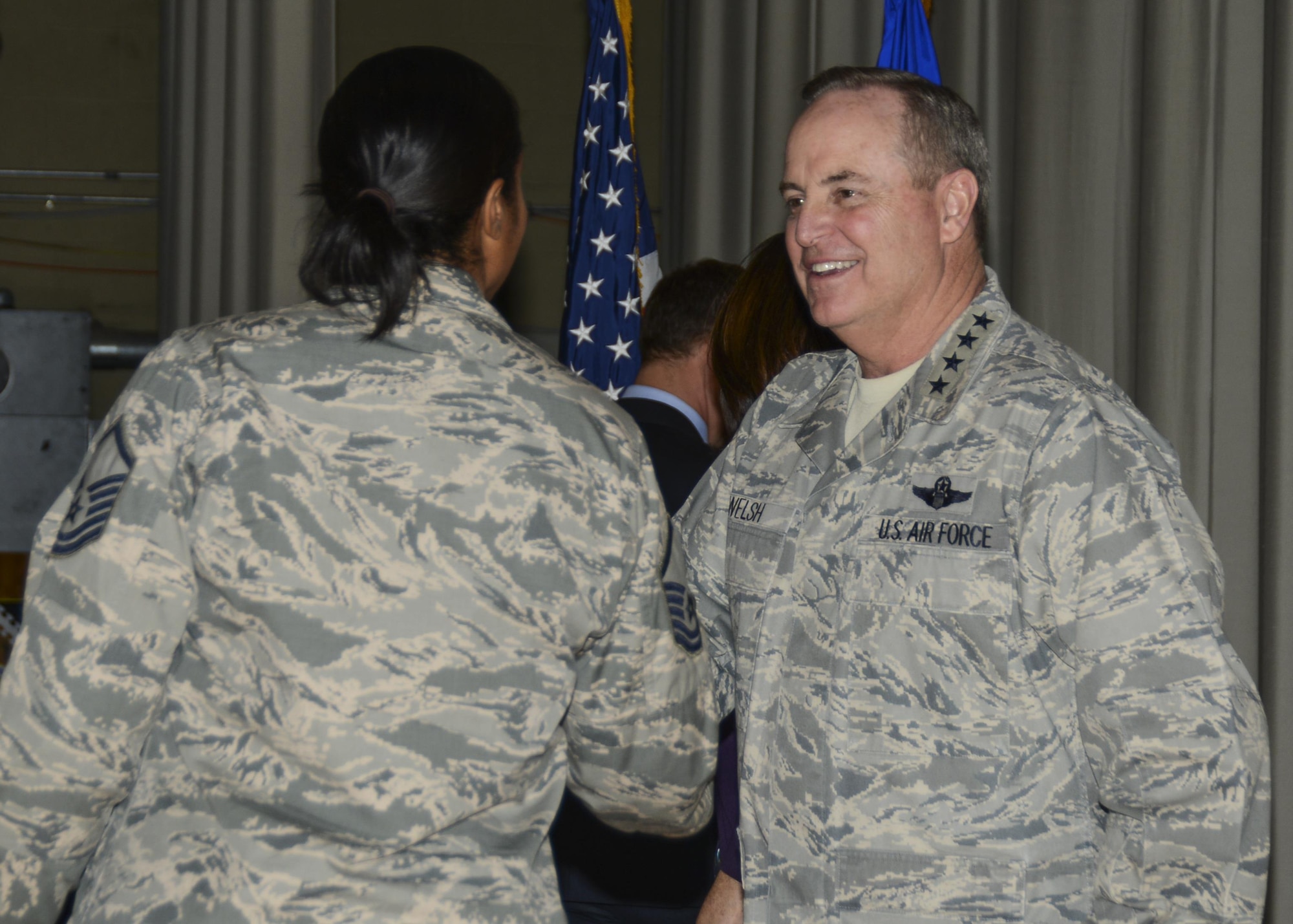 Chief of Staff Gen. Mark A. Welsh III shook hands with airmen at an all call Jan. 30, 2014, held inside the base theater at Edwards Air Force Base, Calif. Welsh visited Edwards AFB from Jan. 29 to Jan. 31 to meet with the Edwards AFB workforce and receive briefings on test programs. (U.S. Air Force photo/Rebecca Amber) 