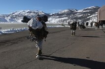 Service members with Ragnarok Company, 2nd Supply Battalion, 2nd Marine Logistics Group disembark from a CH-47 Chinook following the end of a field exercise aboard Marine Corps Mountain Warfare Training Center, Bridgeport, Calif., Feb. 5, 2014. The CH-47s gave service members a unique opportunity among the Marines and sailors of Ragnarok Co. to move equipment and personnel without over-land travel.