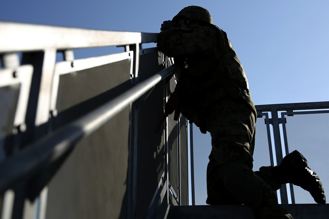 A soldier from the Japan Ground Self-Defense Force identifies targets while conducting call-for-fire exercises with 1st Air Naval Gunfire Liaison Company during Exercise Iron Fist 2014 aboard Camp Pendleton, Calif., Feb. 5, 2014. Iron Fist 2014 is an amphibious exercise that brings together Marines and sailors from the 15th Marine Expeditionary Unit, other I Marine Expeditionary Force units, and soldiers from the JGSDF, to promote military interoperability and hone individual and small-unit skills through challenging, complex and realistic training. (U.S. Marine Corps photo by Lance Cpl. Anna K. Albrecht/Released)