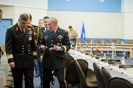 18th Chairman of the Joint Chiefs of Staff Gen. Martin E. Dempsey speaks with Egyptian Deputy Chief of Defense Vice Adm. Ahmed Khaled while attending the 170th NATO Chiefs of Defense meeting at NATO headquarters in Brussels, Belgium, January 22, 2014. DoD photo by Mass Communication Specialist 1st Class Daniel Hinton