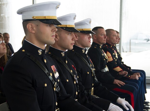 Kyle Davis, Najieb Mahmoud and Justin Hillebrand accept their commissions as Second Lieutenants in the United States Marine Corps at the Milwaukee County War Memorial Center, Jan. 24, 2014.