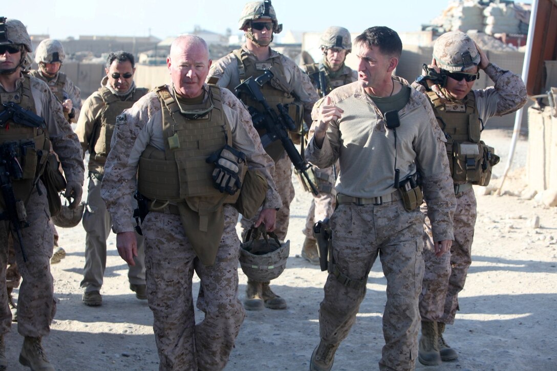 Major Gen. W. Lee Miller Jr., left, commanding general of Regional Command (Southwest), is welcomed by Col. Christopher Douglas, right, team leader for Security Force Assistance Advisor Team 2-215, during a visit to an Afghan National Army base near Forward Operating Base Nolay, Afghanistan, Jan. 28, 2014. Major Gen. Miller visited the base to speak with officials of ANA 2nd Brigade, 215th Corps, and the Afghan Uniformed Police about an ongoing operation being conducted in the Sangin Valley, Helmand province.
