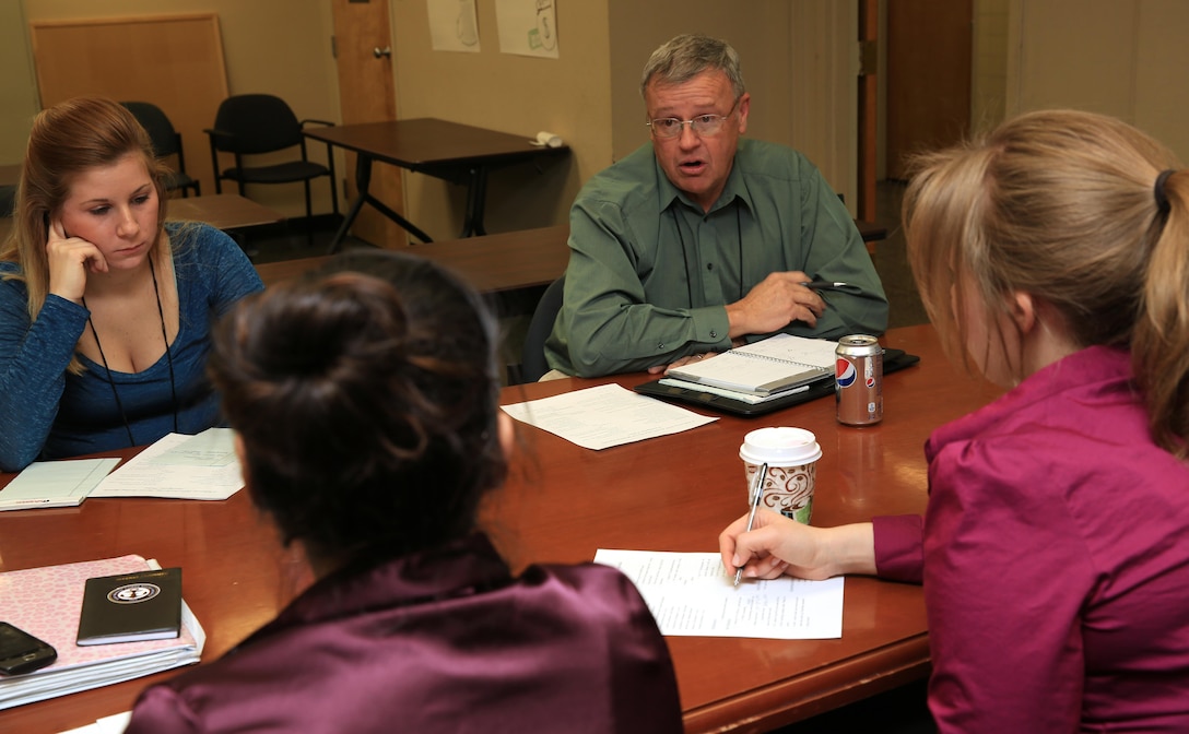 Raymond Caldwell, director, Navy Marine Corps Relief Society Twentynine Palms Office, briefs volunteers on the NMCRS's future goals during their monthly meeting Feb. 3rd at the Village Center. The NMCRS is always trying to find new ways to help Marines and their families.