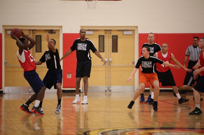 The Officer Candidates School and Combat Camera basketball teams play against each other at Barber Physical Activity Center on Jan. 29, 2014. OCS won in triple overtime 65-63.