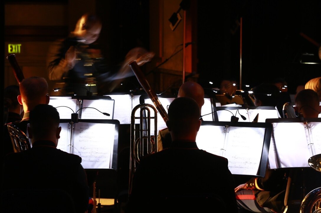 Chief Warrant Officer Edward Hayes, the 1st Marine Division band officer, conducts during the 1st Marine Division 73rd anniversary concert at Escondido, Calif., Jan. 31, 2014. The band played a variety of pieces at the concert, each representing different experiences that Marines go through from recruit training to missing the birth of a child while on deployment. The concert was held to strengthen relationships between the Marine Corps and the local community.