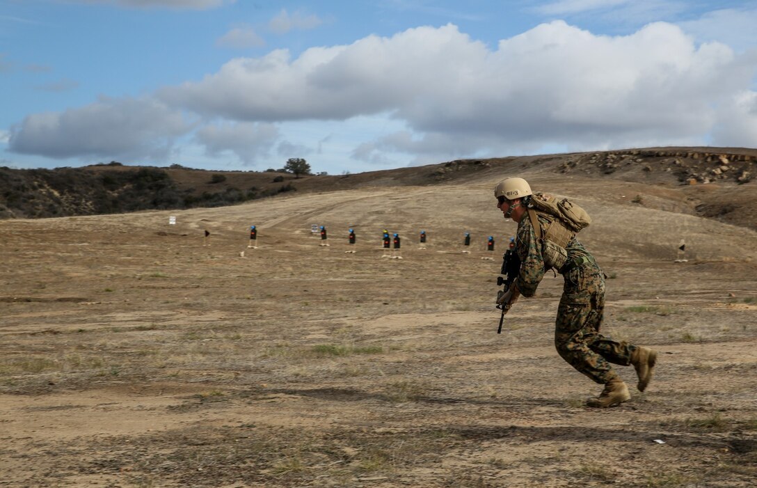 U.S. Marine Sgt. David Johnson, 1st Reconnaissance Battalion, 1st Marine Division, moves to his next firing position while conducting immediate-action drills with the Japan Ground Self-Defense Force during Exercise Iron Fist 2014 aboard Camp Pendleton, Calif., Feb. 4, 2014. Iron Fist is an amphibious exercise that brings together Marines and sailors from the 15th Marine Expeditionary Unit, other I Marine Expeditionary Force units, and soldiers from the JGSDF, to promote military interoperability and hone individual and small-unit skills through challenging, complex and realistic training. 