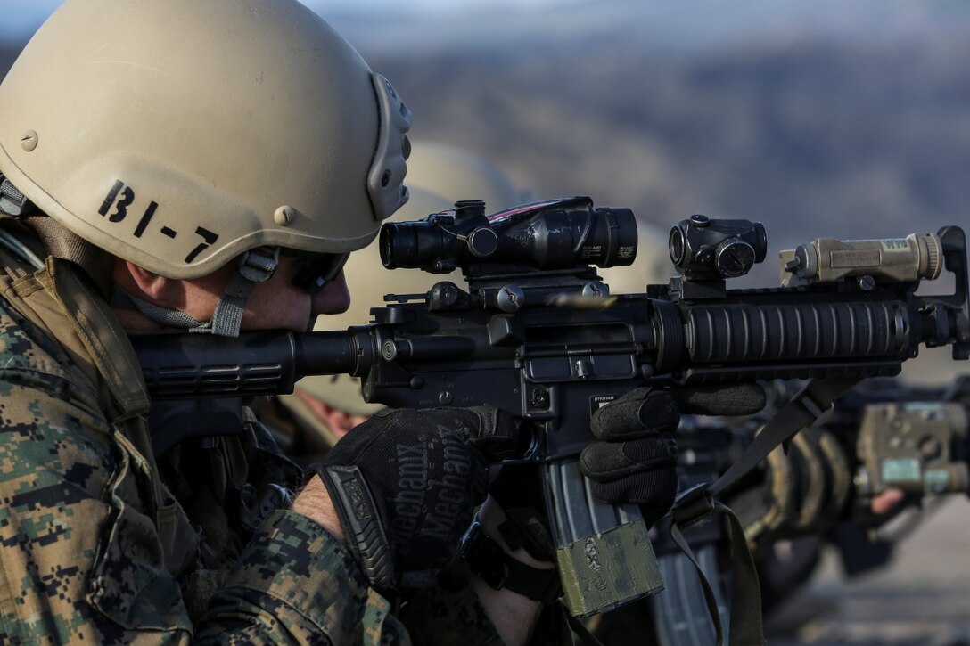 U.S. Marine Sgt. Jesse Kimble, 1st Reconnaissance Battalion, 1st Marine Division, fires at a target while conducting immediate-action drills with soldiers from the Japan Ground Self-Defense Force during Exercise Iron Fist 2014 aboard Camp Pendleton, Calif., Feb. 4, 2014. Iron Fist is an amphibious exercise that brings together Marines and sailors from the 15th Marine Expeditionary Unit, other I Marine Expeditionary Force units, and soldiers from the JGSDF, to promote military interoperability and hone individual and small-unit skills through challenging, complex and realistic training. (U.S. Marine Corps photo by Cpl. Emmanuel Ramos/Released)
