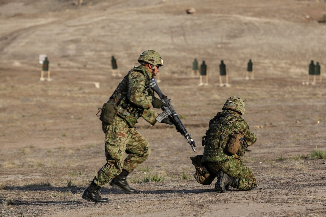 A soldier from the Japan Ground Self-Defense Force moves to his next firing position while conducting immediate-action drills with 1st Reconnaissance Battalion, 1st Marine Division, during Exercise Iron Fist 2014 aboard Camp Pendleton, Calif., Feb. 4, 2014. Iron Fist is an amphibious exercise that brings together Marines and sailors from the 15th Marine Expeditionary Unit, other I Marine Expeditionary Force units, and soldiers from the JGSDF, to promote military interoperability and hone individual and small-unit skills through challenging, complex and realistic training. (U.S. Marine Corps photo by Cpl. Emmanuel Ramos/Released)
