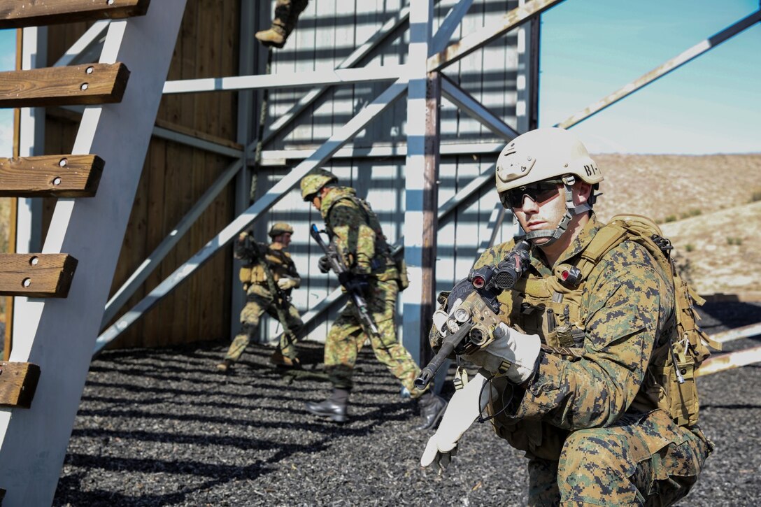 U.S. Marine Sgt. Jesse Kimble, 1st Reconnaissance Battalion, 1st Marine Division, provides security while conducting fast-rope training with the Japan Ground Self-Defense Force during Exercise Iron Fist 2014 aboard Camp Pendleton, Calif., Feb. 5, 2014. Iron Fist is an amphibious exercise that brings together Marines and sailors from the 15th Marine Expeditionary Unit, other I Marine Expeditionary Force units, and soldiers from the JGSDF, to promote military interoperability and hone individual and small-unit skills through challenging, complex and realistic training. 