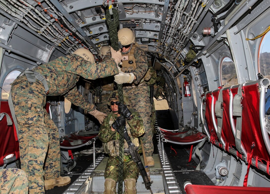 A soldier from the Japan Ground Self-Defense Force positions himself to fast rope from a  CH-46E Sea Knight while conducting fast-rope training with 1st Reconnaissance Battalion, 1st Marine Division, during Exercise Iron Fist 2014 aboard Camp Pendleton, Calif., Feb. 5, 2014. Iron Fist is an amphibious exercise that brings together Marines and sailors from the 15th Marine Expeditionary Unit, other I Marine Expeditionary Force units, and soldiers from the JGSDF, to promote military interoperability and hone individual and small-unit skills through challenging, complex and realistic training. 