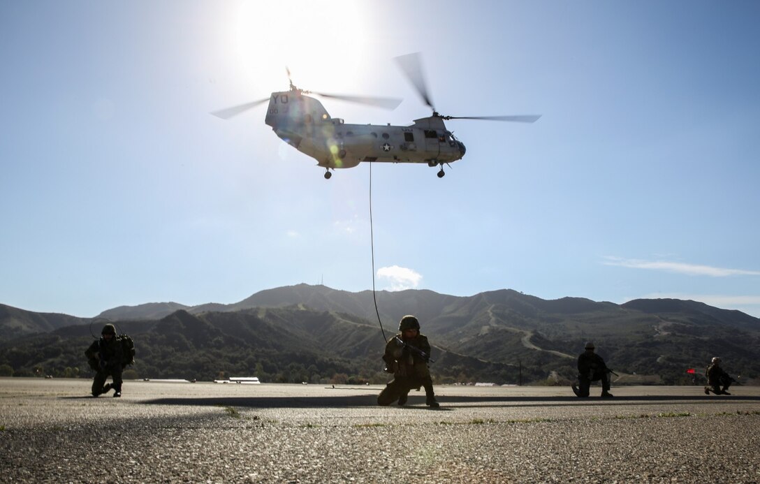 U.S. Marines from 1st Reconnaissance Battalion, 1st Marine Division, and soldiers with the Japan Ground Self-Defense Force, provide security while conducting fast rope-training during Exercise Iron Fist 2014 aboard Camp Pendleton, Calif., Feb. 5, 2014. Iron Fist is an amphibious exercise that brings together Marines and sailors from the 15th Marine Expeditionary Unit, other I Marine Expeditionary Force units, and soldiers from the JGSDF, to promote military interoperability and hone individual and small-unit skills through challenging, complex and realistic training. (U.S. Marine Corps photo by Cpl. Emmanuel Ramos/Released)