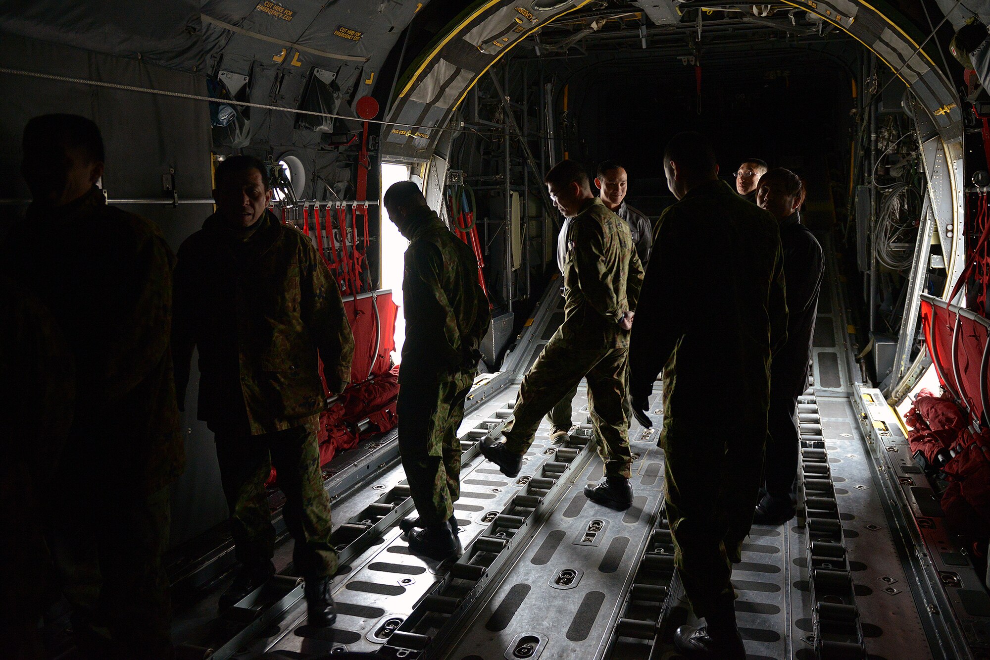 Members of the Japan Ground Self-Defense Force explore the inside of a C-130 Hercules at Yokota Air Base, Japan, Feb. 6, 2014. The tour was used to share training methods and strengthen the bonds between allied forces. (U.S. Air Force photo by Airman 1st Class David Danford/Released)