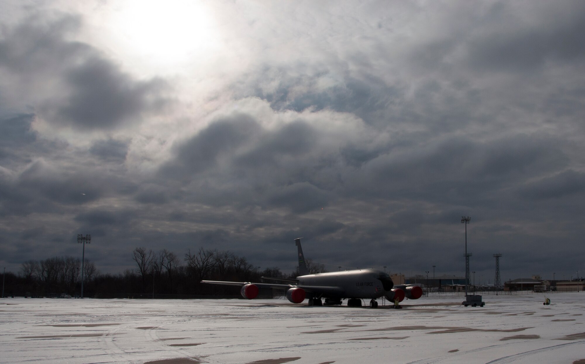 A KC-135R Stratotanker sits alone on the 507th Air Refueling Wing’s flight line as the snow storm that hit central Oklahoma and Tinker AFB Thursday Feb. 6, 2014 moved past leaving behind three inches of snow and a solid glaze of ice.  All flight operations were cancelled due to snow, ice and wind chills hovering around 15 below zero.  (U.S. Air Force photo/Senior Airman Mark Hybers)