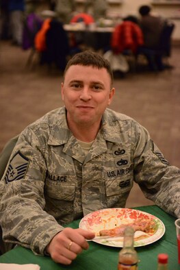 Master Sgt. Kevin Wallace, 366th Fighter Wing Public Affairs photojournalist, enjoys his meal at the Soul Food Taste Fest held at the Gunfighter Service Center, Feb. 5, 2014 at Mountain Home Air Force Base, Idaho. Airmen from different organizations came to enjoy the various foods offered at the event. (U.S. Air Force photo by Airman 1st Class Malissa Lott/RELEASED)