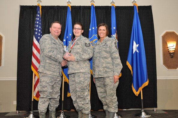 Brig. Gen. Samuel Mahaney, Air Reserve Personnel Center commander, and Chief Master Sgt. Ruthe Flores, ARPC command chief, present the Force Support Noncommissioned Officer of the Year award to Tech. Sgt. Amy Burum. Mahaney honored ARPC’s 2013 outstanding performers of the year as well as their A1 annual award winners at the Summit Conference and Event Center Feb. 6, 2014, in Denver. (U.S. Air Force photo/Tech. Sgt. Rob Hazelett)