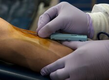Jose Garcia, son of retired Tech. Sgt. Jose Garcia, donates blood to the American Red Cross Feb. 5, 2014, at Joint Base Charleston - Air Base, S.C. The donated blood will be sent to a Red Cross blood component laboratory where it will be processed into several components; red blood cells, plasma, platelets and/or cryoprecipitate. A single blood donation may help up to three different people. (U.S. Air Force photo/Senior Airman Ashlee Galloway)