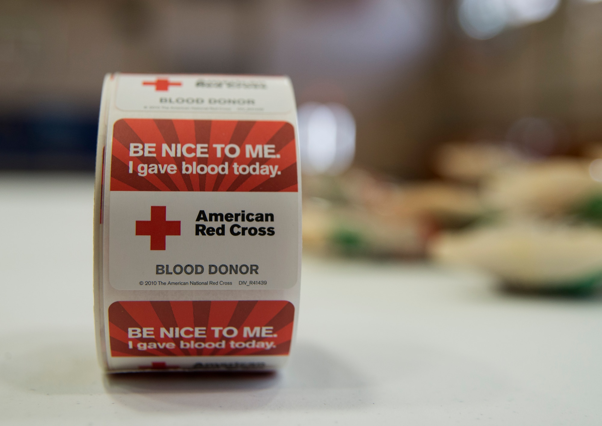 Blood donors receive stickers after donating their blood during the American Red Cross blood drive Feb. 5, 2014, at Joint Base Charleston - Air Base, S.C. The donated blood will be sent to a Red Cross blood component laboratory where it will be processed into several components; red blood cells, plasma, platelets and/or cryoprecipitate. A single blood donation may help up to three different people. (U.S. Air Force photo/Senior Airman Ashlee Galloway)

