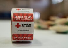 Blood donors receive stickers after donating their blood during the American Red Cross blood drive Feb. 5, 2014, at Joint Base Charleston - Air Base, S.C. The donated blood will be sent to a Red Cross blood component laboratory where it will be processed into several components; red blood cells, plasma, platelets and/or cryoprecipitate. A single blood donation may help up to three different people. (U.S. Air Force photo/Senior Airman Ashlee Galloway)

