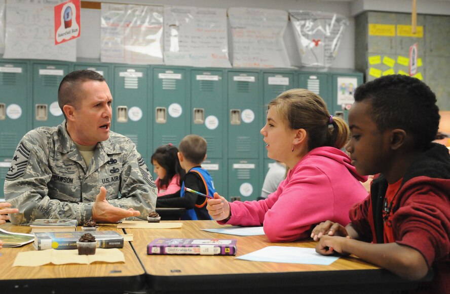 Chief Master Sgt. Ray Dawson, command chief of the Kentucky Air National Guard’s 123rd Airlift Wing in Louisville, Ky., talks with fourth-grade students at Clear Creek Elementary School in Shelbyville, Ky., Jan. 9, 2014, during a visit to thank them for their support of the wing's deployed Airmen. The students “adopted” unit members who are currently serving in Afghanistan, sending them letters and snacks. (U.S. Air National Guard photo by Staff Sgt. Vicky Spesard)
