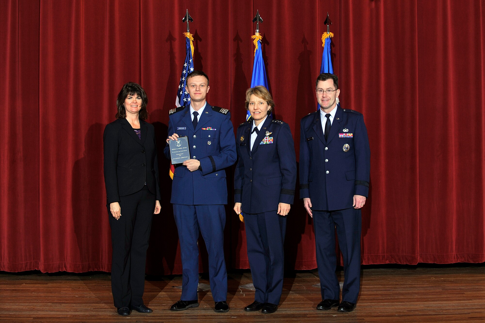 Left to right: Dr. Mica Endsley, Cadet 1st Class Zachary Decker, Lt. Gen. Michelle Johnson, and Brig. Gen. Andrew Armacost pose at the 2014 USAFA Research Awards ceremony here Jan. 31. Decker won the Thomas D. Moore Award for Oustanding Summer Research. (U.S. Air Force Photo/Sam Lee)