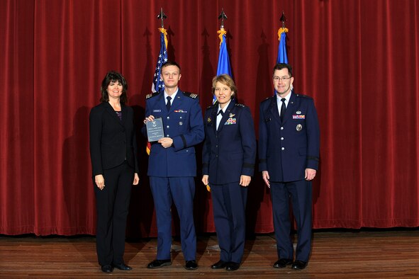 Left to right: Dr. Mica Endsley, Cadet 1st Class Zachary Decker, Lt. Gen. Michelle Johnson, and Brig. Gen. Andrew Armacost pose at the 2014 USAFA Research Awards ceremony here Jan. 31. Decker won the Thomas D. Moore Award for Oustanding Summer Research. (U.S. Air Force Photo/Sam Lee)