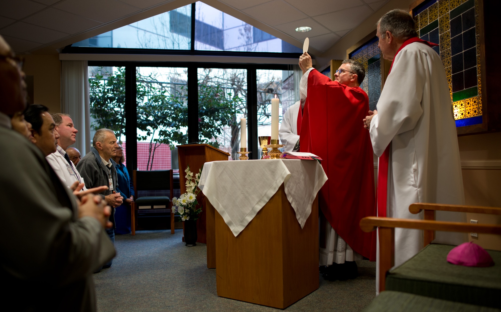 Archbishop Timothy Broglio, archdiocese for the military services, celebrates Catholic worship at the David Grant USAF Medical Centre chapel, Feb. 3, 2014. During his three-day visit to Travis AFB, Calif., Broglio met with the installation leadership, Airmen and civilians to learn about the diverse mission of the base, as well as offer pastoral counsel. (U.S. Air Force photo/Ken Wright)