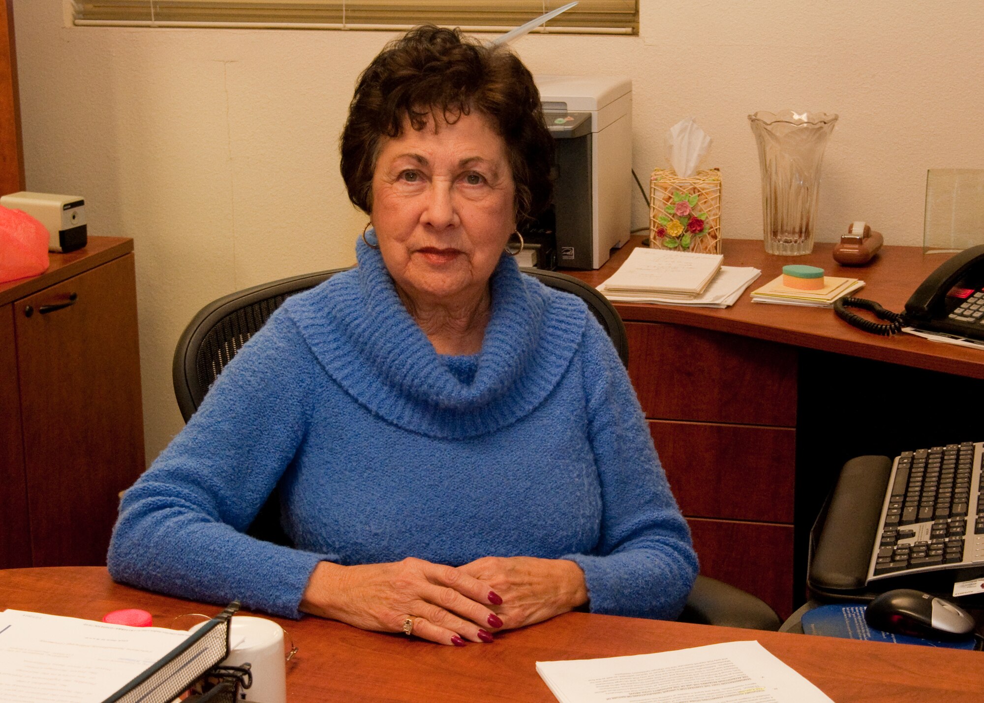 Josephine Cobb, 60th Contracting Squadron contracting officer sits at her desk Feb. 3, 2014, at Travis Air Force Base, Calif. Cobb is set to retire on April 3 after 53 years of government civil service, with 51 of those years spent at Travis. (U.S. Air Force photo by Senior Airman Charles V. Rivezzo)