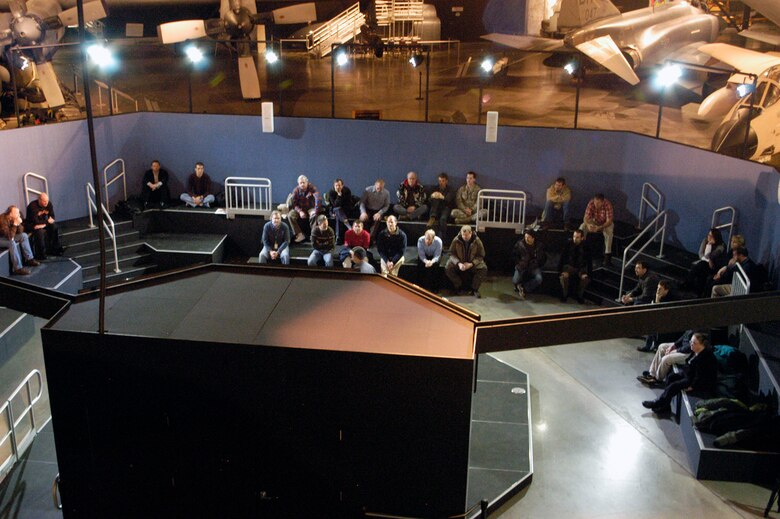 DAYTON, Ohio -- A group uses the STEM Learning Node, which is adjacent to the space shuttle exhibit in the Cold War Gallery at the National Museum of the U.S. Air Force. (U.S. Air Force photo)