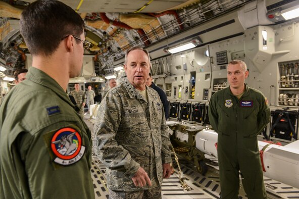 Air Force Chief of Staff Gen. Mark A. Welsh III receives a Prime Nuclear Airlift Force briefing from Capt. Art Dulin, 62nd Operations Support Squadron chief of readiness, left, and Tech. Sgt. Ben Messenger, 4th Airlift Squadron loadmaster, Feb. 3, 2014, at Joint Base Lewis-McChord, Wash. PNAF is a mission that is unique to the 4th AS, the only unit in the Air Force qualified to airlift nuclear materials. (U.S. Air Force photo/Tech. Sgt. Sean Tobin)