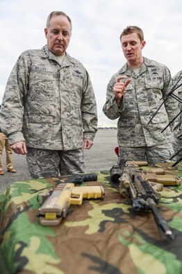 Staff Sgt. Nathan Vogle, 22nd Special Tactics Squadron combat controller, briefs Air Force Chief of Staff Gen. Mark A. Welsh III, Feb. 3, 2014, on various weapons and communications equipment used by the 22nd STS, at Joint Base Lewis-McChord, Wash. The 22nd STS is a tenant unit on McChord Field and falls under the Air Force Special Operations Command. (U.S. Air Force photo/Tech. Sgt. Sean Tobin)