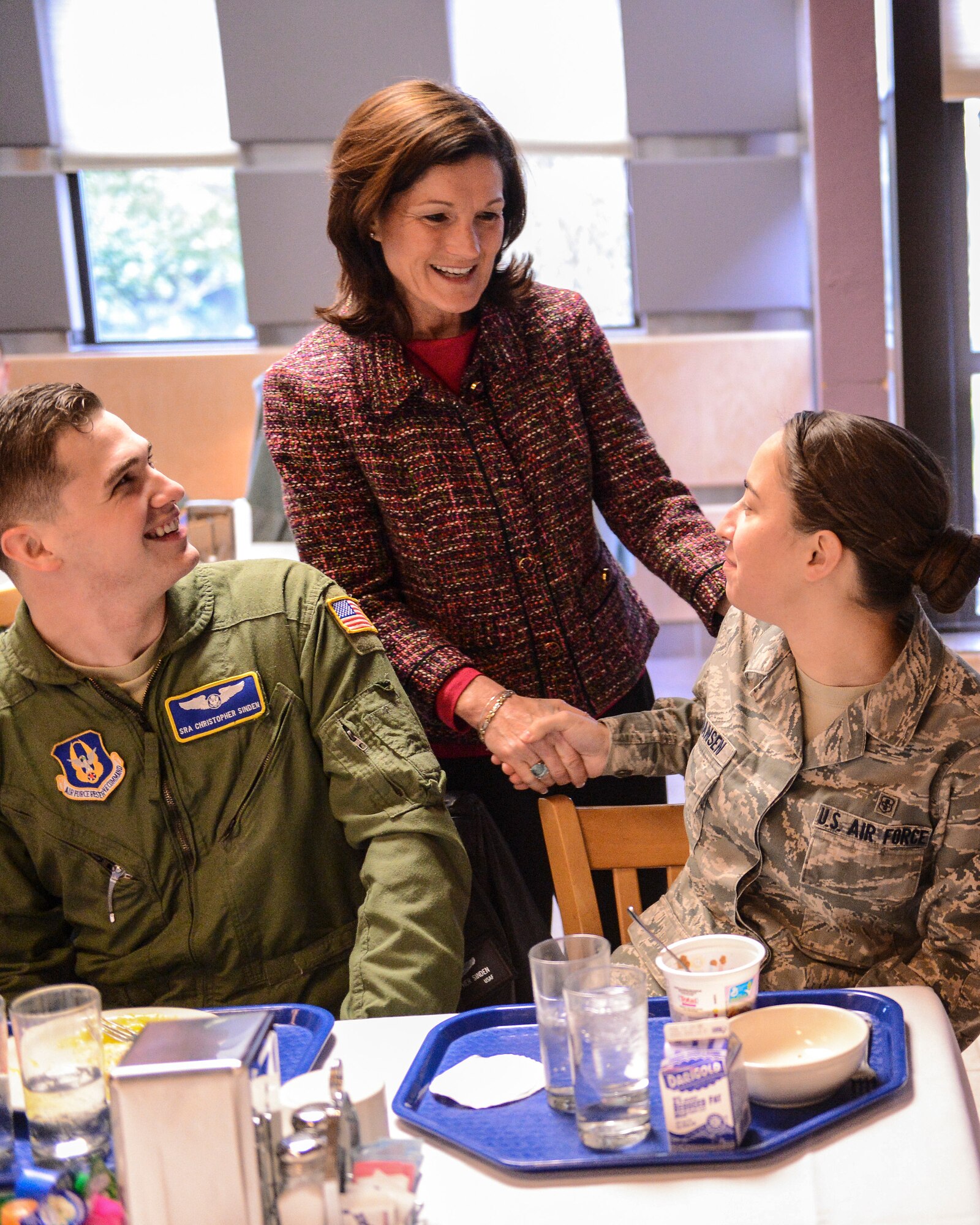 Betty Welsh, wife of Air Force Chief of Staff Gen. Mark A. Welsh III, meets with Senior Airman Christopher Sinden, 313th Airlift Squadron loadmaster, and Senior Airman Erin Johansen, 62nd Medical Squadron aerospace medical technician, Feb. 4, 2014, during an Airmen's breakfast at Joint Base Lewis-McChord, Wash. Gen. and Mrs. Welsh had breakfast with a group of Team McChord Airmen and spouses and answered questions from the members. (U.S. Air Force photo/Tech. Sgt. Sean Tobin)