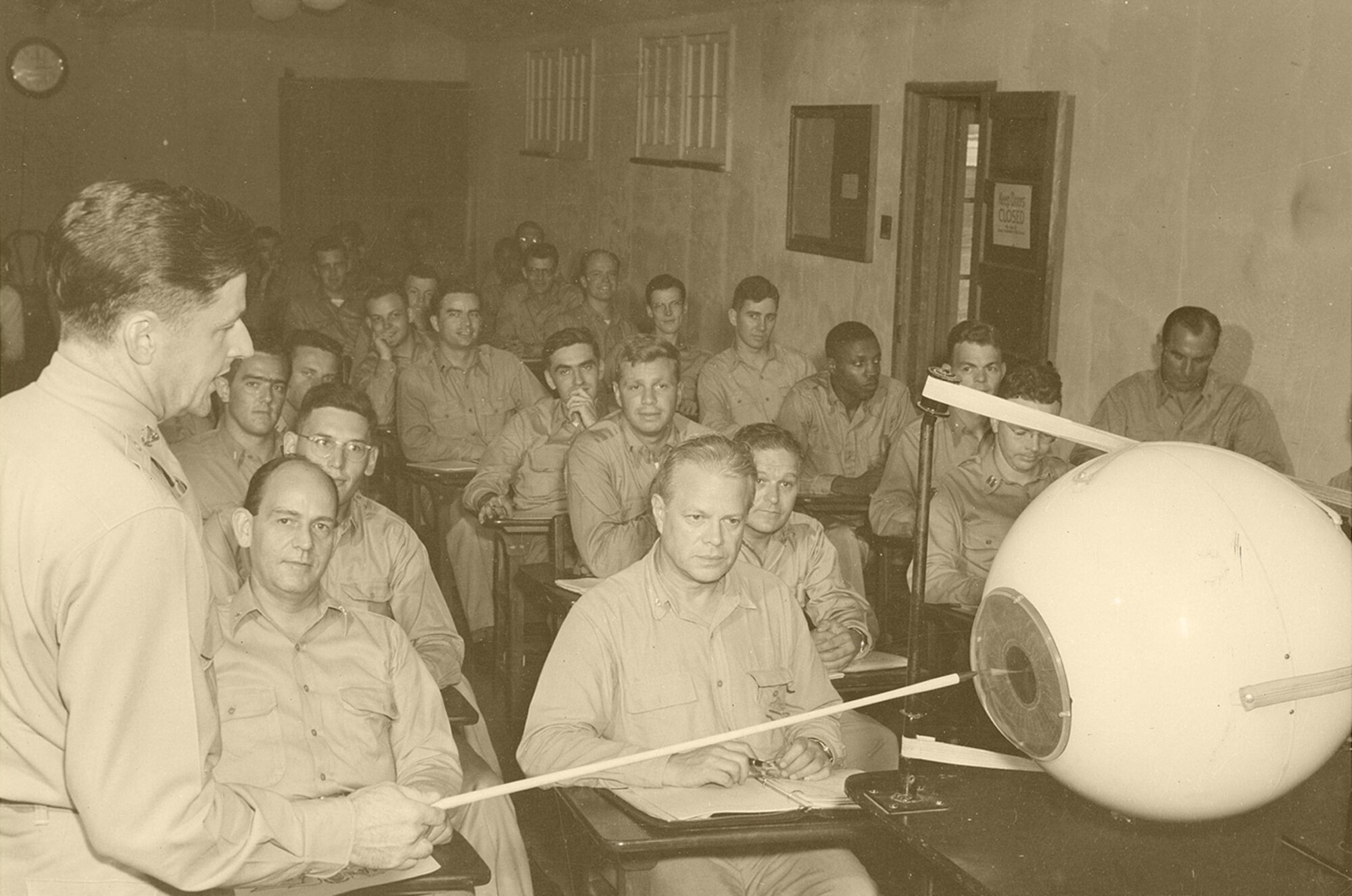 An Air Force officer delivers a lecture on ophthalmology using the giant model of the human eye as an instructional aid circa 1949. (courtesy photo)
