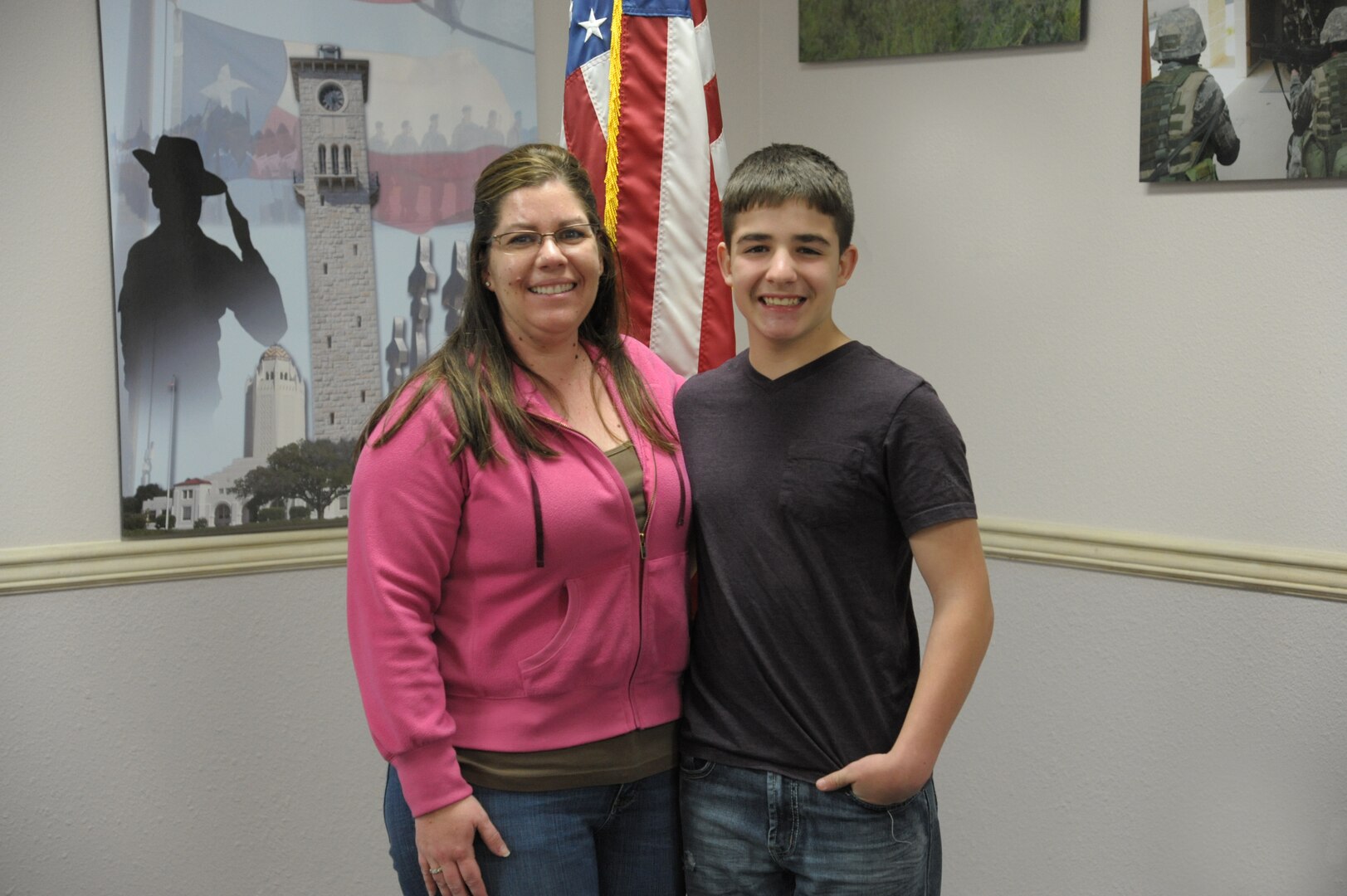 Hunter Johnson (right), semi-finalist for the 2014 Military Child of the Year Award, stands with his mother April Johnson, wife of Tech. Sgt. Johnathon Johnson, Air Force Personnel Center cyber operations scheduler, Jan. 31 at Joint Base San Antonio-Randolph. (U.S. Air Force photo by Joel Martinez)