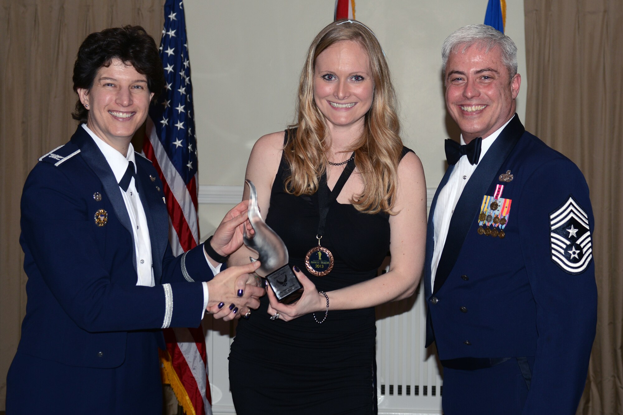 RAF ALCONBURY, United Kingdom - Nikki Threatt, 423rd Security Forces Squadron, was named the 501st Combat Support Wing's Key Spouse of the Year. Threatt, from Albany, Ore., organized a meal train for a family with a severely ill member in hospital, providing 25 meals so the family could focus on medical care. She also volunteered 47 hours with the Sure Start Program and six Chapel dinners. (U.S. Air Force photo by Tech. Sgt. Chrissy Best)