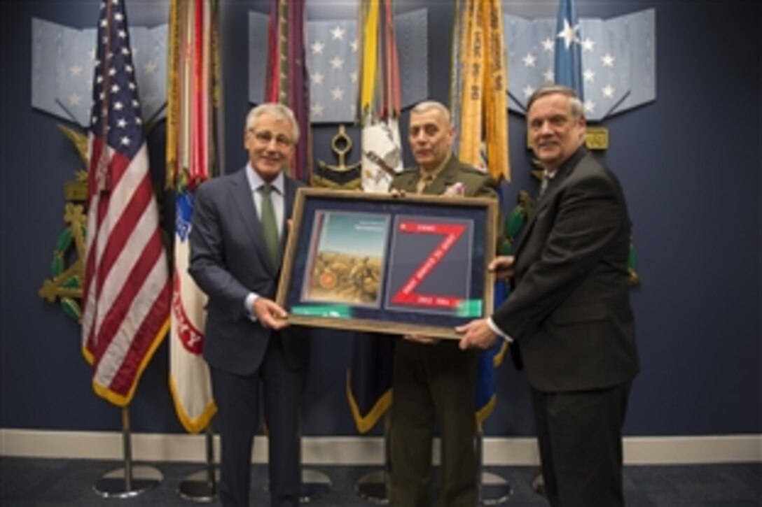 Defense Secretary Chuck Hagel, left, holds a plaque with Marine Gen. John M. Paxton Jr., Marine Corps assistant commandant, and Robert F. Hale, the Pentagon's comptroller, after delivering remarks during a ceremony at the Pentagon's Hall of Heroes, Feb. 6, 2014, to recognize the audit success of the U.S. Marine Corps and Defense Department organizations.