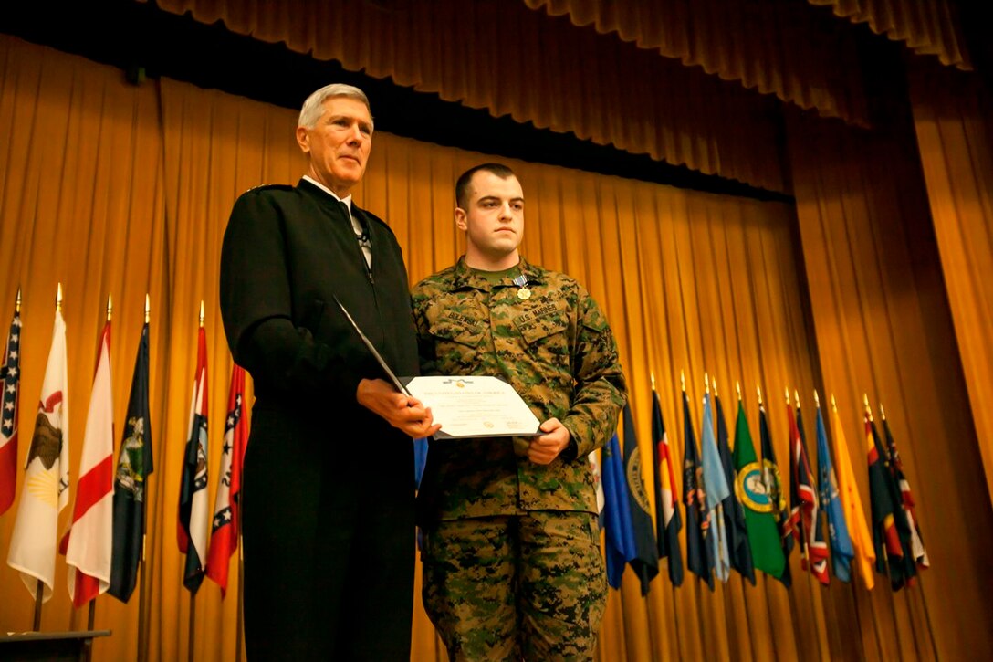 CAMP FOSTER-- Lance Cpl. Ross D. Bolewski, right, and Adm. Samuel J. Locklear III pose for photographs after Bolewski was awarded the Joint Service Achievement Medal Feb. 7 at the Camp Foster Theater. Locklear, commander of U.S. Pacific Command located in Hawaii, visited Okinawa to meet with senior U.S. military representatives and recognize service members for their efforts during Operation Damayan in the Republic of the Philippines. U.S. military relief efforts during Operation Damayan included approximately 2,748 flight hours, delivering a total of 2,495 tons of humanitarian assistance supplies, and successfully evacuating more than 21,000 people. Bolewski is a data network specialist with 7th Communication Battalion, III Marine Expeditionary Force Headquarters Group, III MEF. U.S. PACOM’s area of operations covers about half of the world’s surface. U.S. Marines on Okinawa are a critical PACOM component. (U.S. Marine Photo by Cpl. Jose D. Lujano/released) 